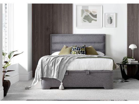 A luxurious contemporary ottoman bed frame with a modern horizontal padded headboard in grey fabric